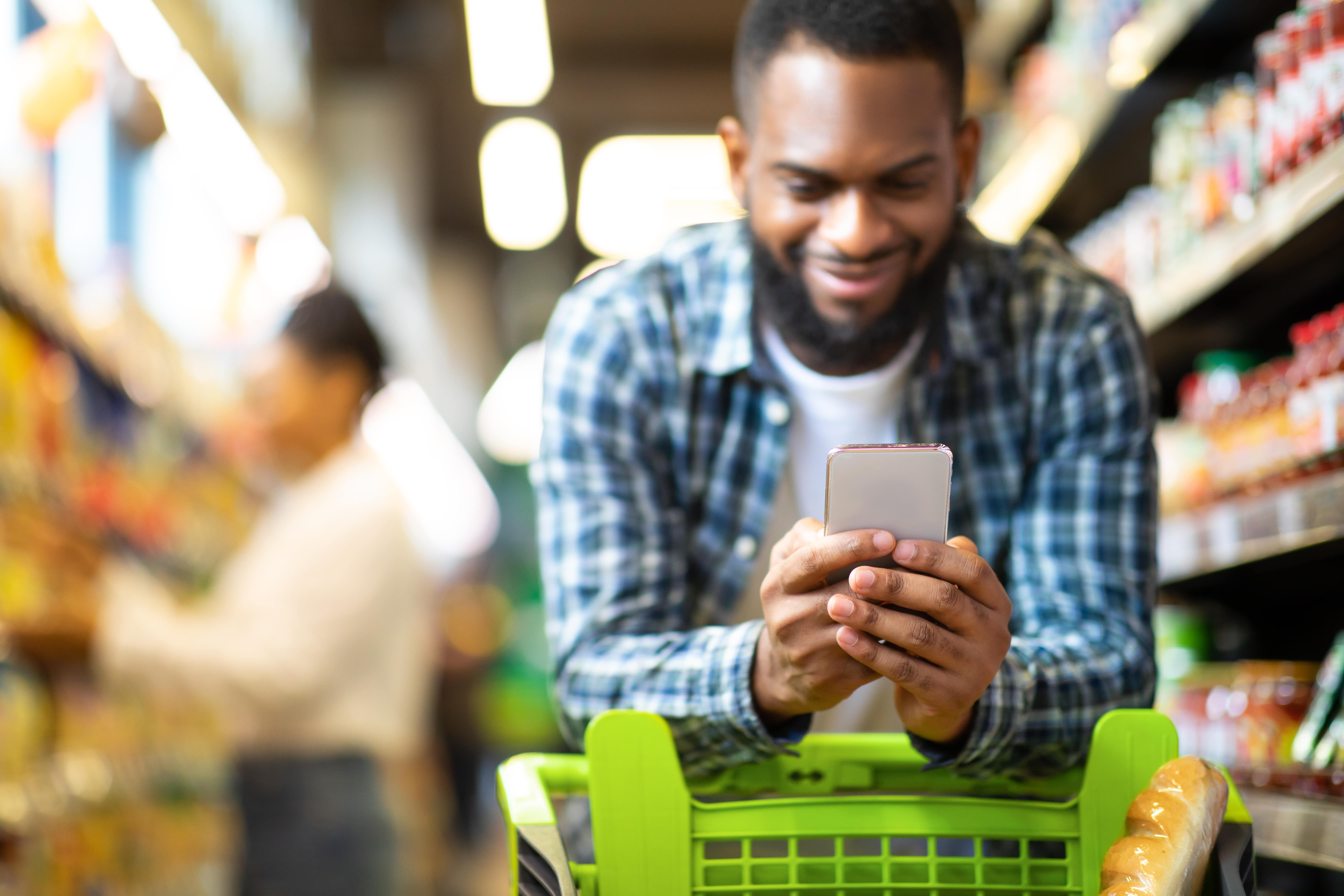 male reading smartphone